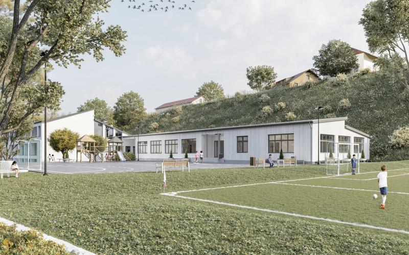 Architekturvisualisierung eines modernen Sportzentrums mit Rasenplatz und angrenzenden Gebäuden.