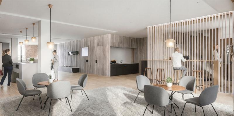 Modernes Bürogebäude-Interieur mit Lounge-Bereich, Stühlen und Empfangsschalter.