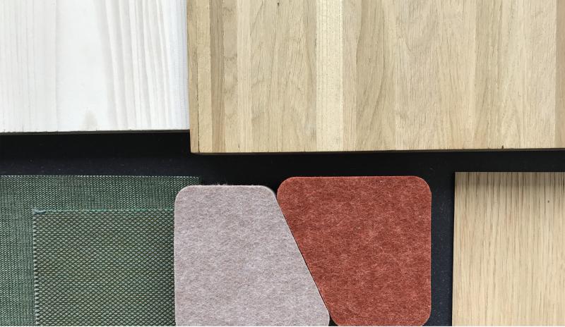 Materialauswahlmuster mit Holz-, Textil- und Teppichoberflächen für das Forschungsgebäude WSL.
