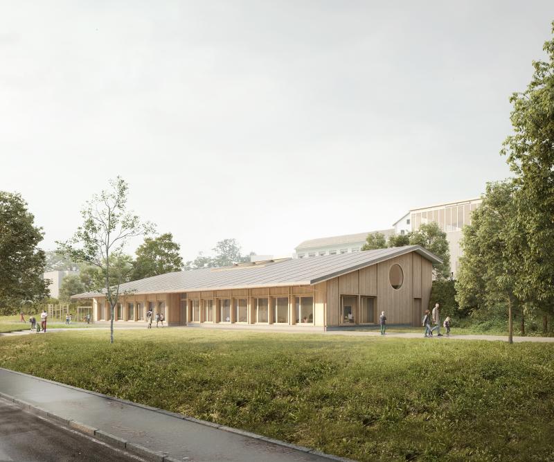 Doppelkindergarten Letten mit Holzfassade in hangseitiger Lage an der Schulanlage Altberg in Oetwil an der Limmat.